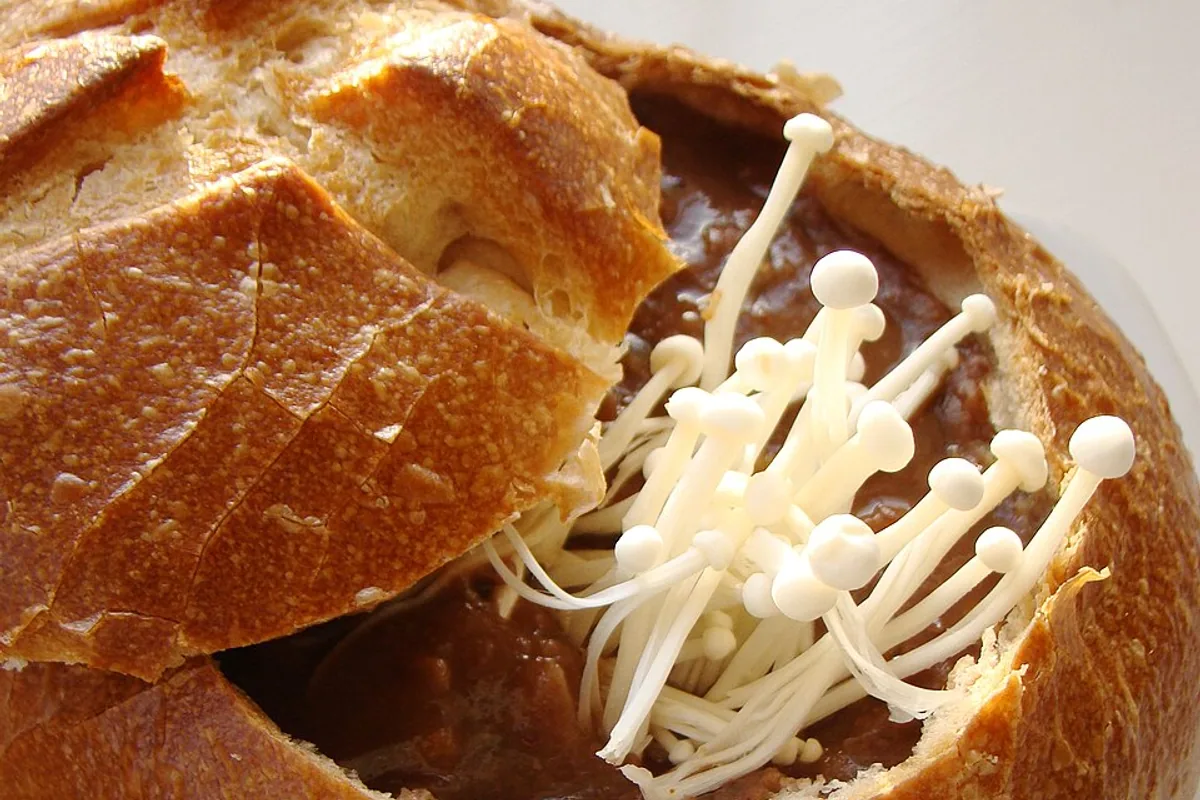 Black bean vegetable and mushroom soup served in a sourdough bread bowl