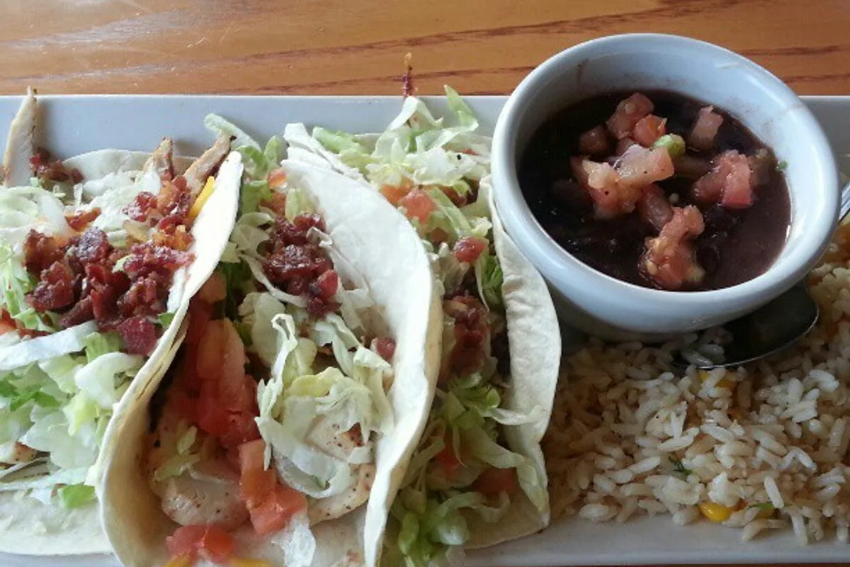 Chicken club tacos with bacon lettuce tomato black beans and rice