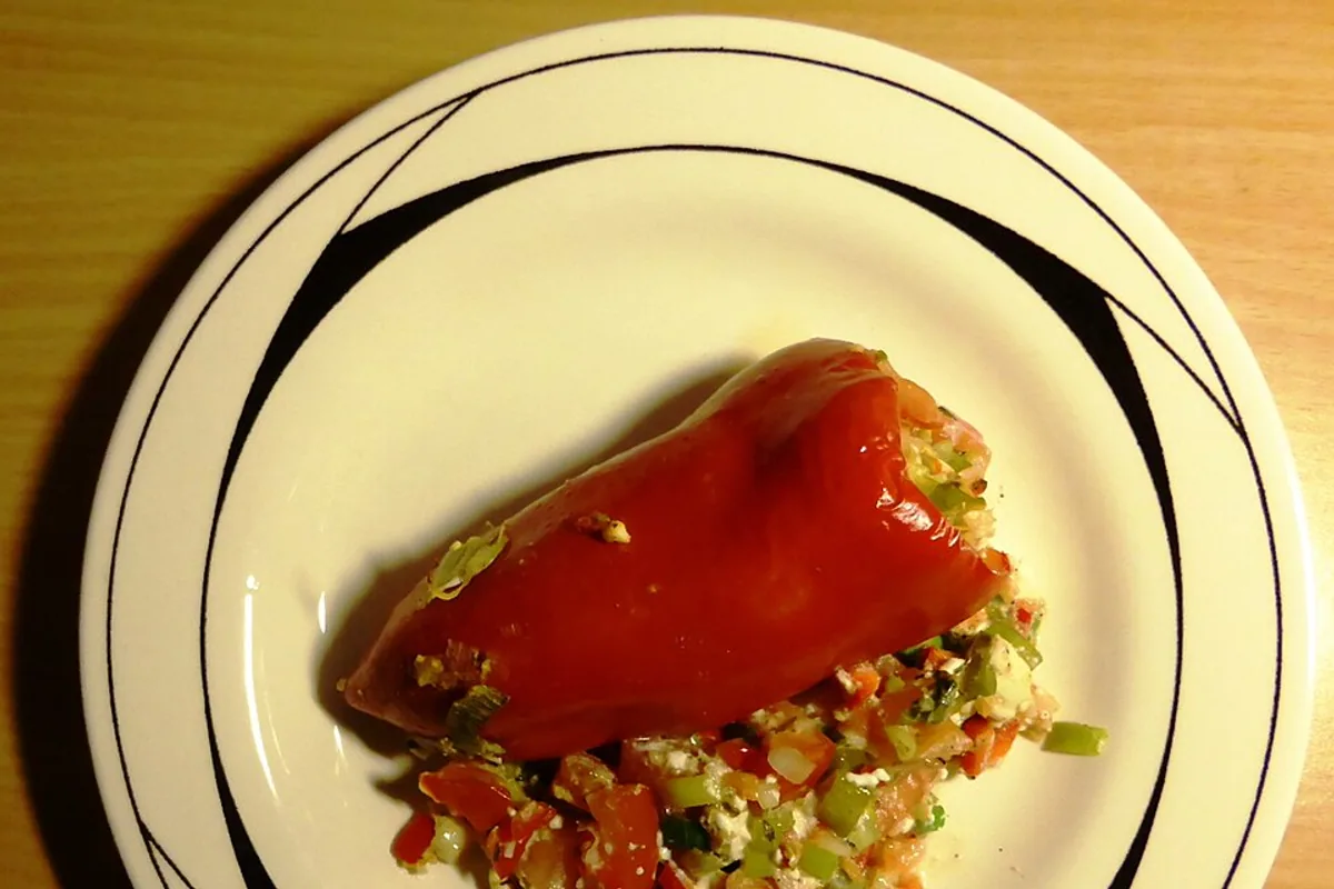 Red bell pepper filled with couscous and vegetables