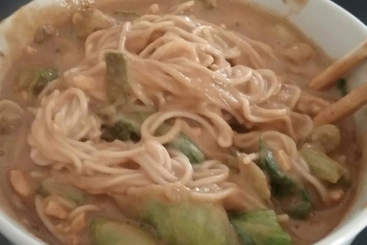 Creamy sesame dan dan noodles with scallions and greens