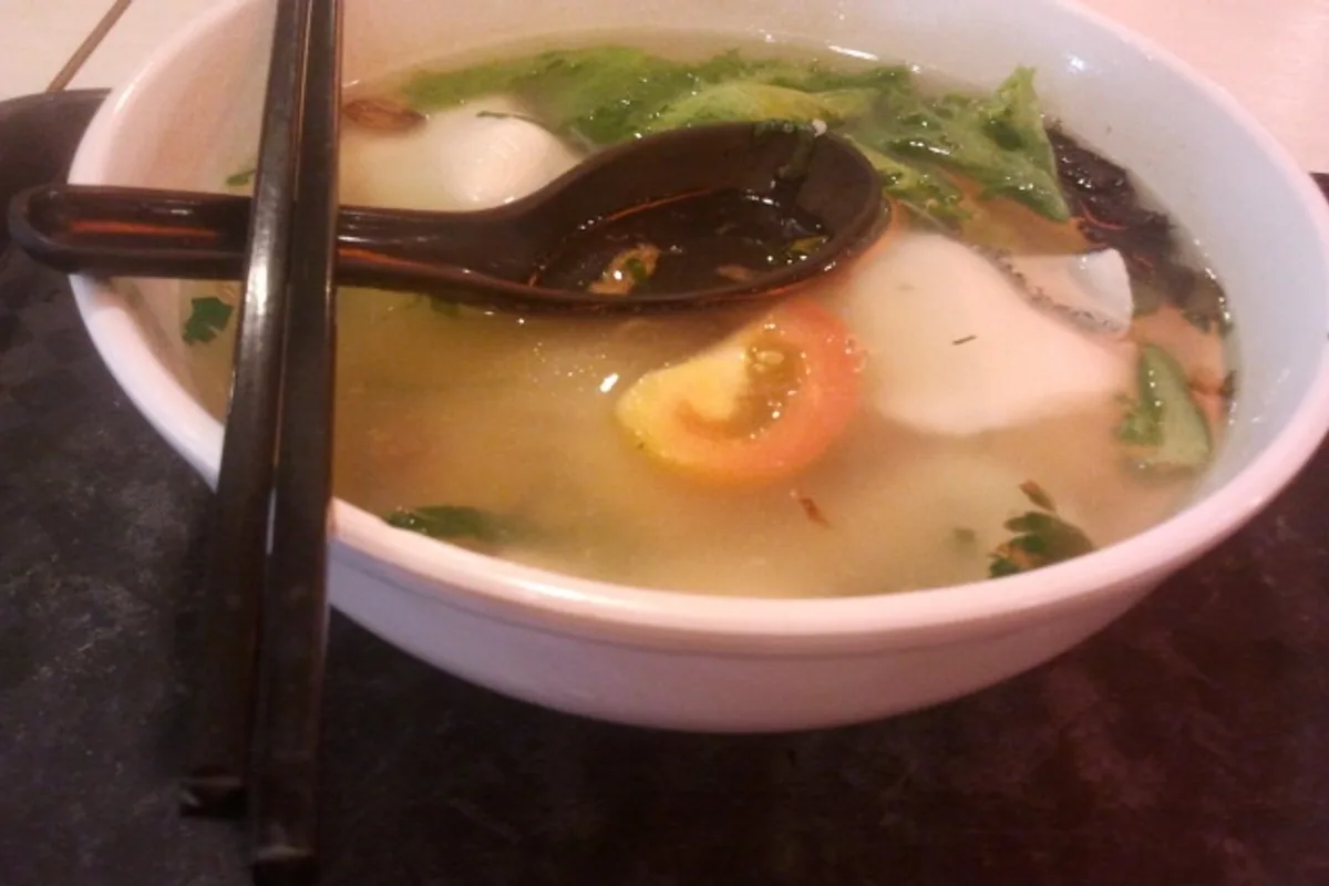 Fish bee hoon soup with rice vermicelli tomato greens and clear broth