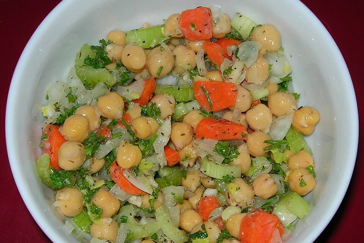 Chickpea chop salad with cucumber tomato celery parsley and lemon dressing