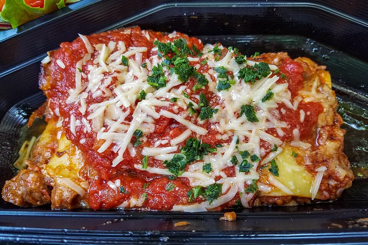 Plated Lasagna Bolognese with beef tomato sauce melted cheese and Parmesan