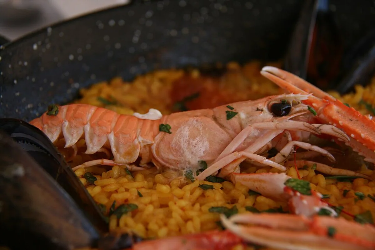 Seafood paella with saffron rice langoustines mussels shrimp and peppers