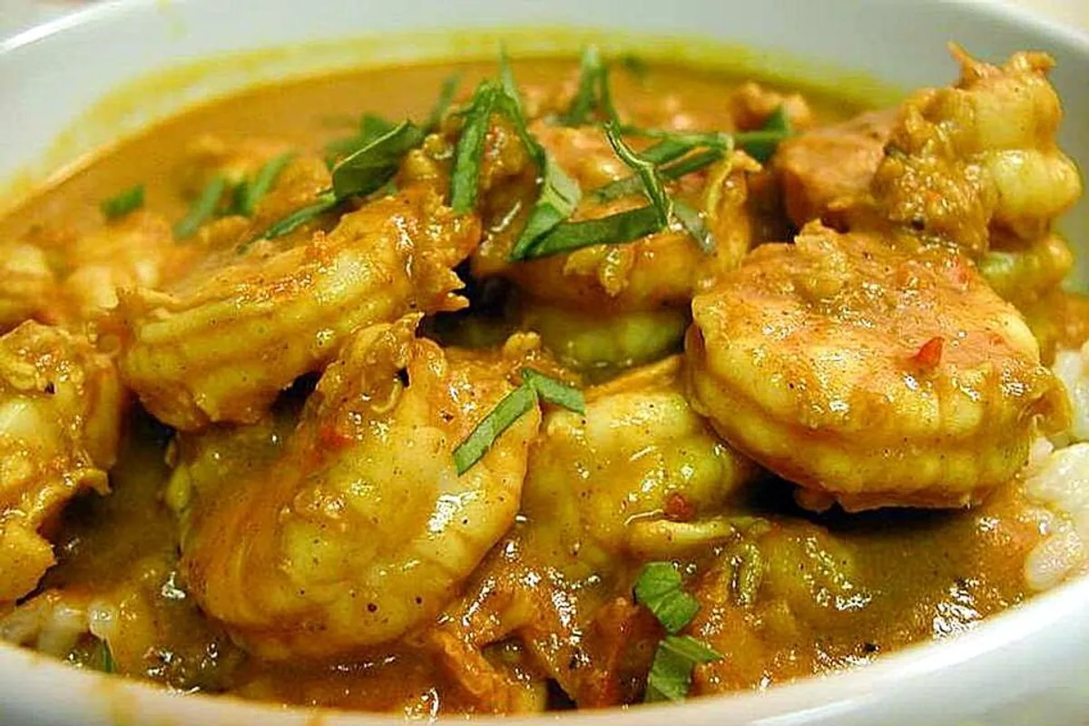 Shrimp and vegetables in a golden curry sauce with fresh herbs