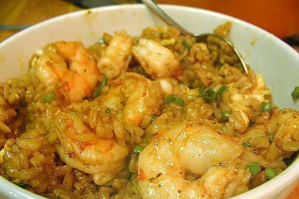 Shrimp fried rice with vegetables herbs and golden seasoned rice