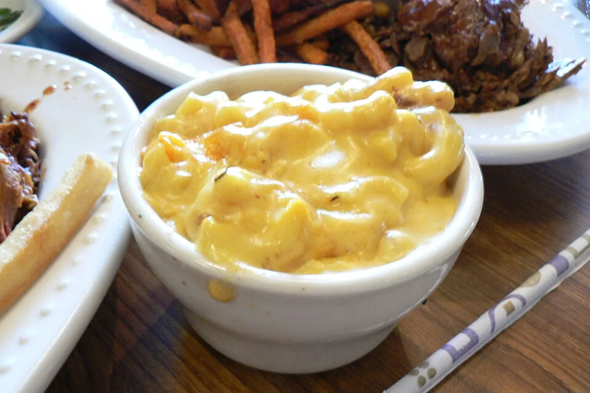 Creamy elbow macaroni and cheese in a white bowl