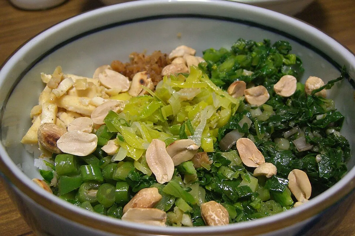 Lei cha rice bowl with tofu green beans leafy greens leeks preserved radish and peanuts