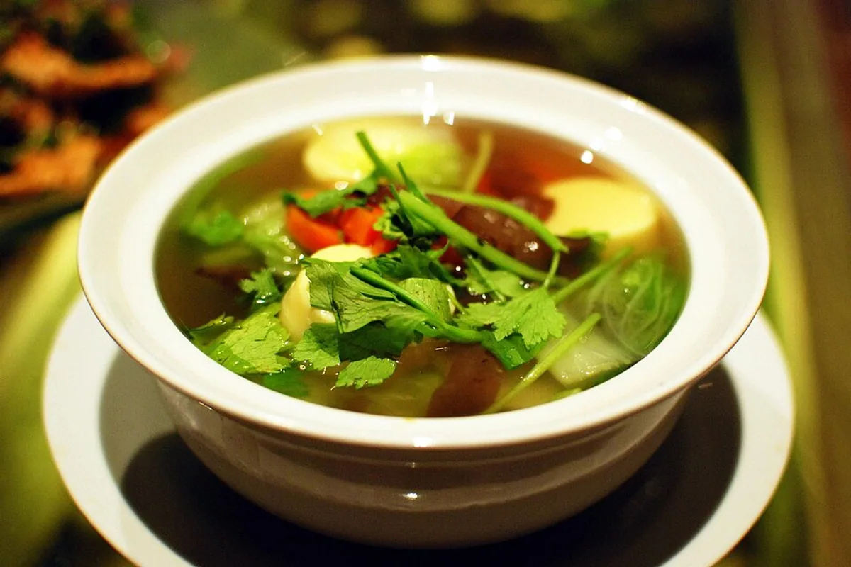 Clear Thai tofu soup with carrots greens and cilantro